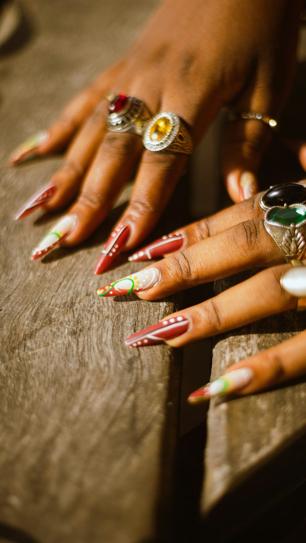 Hands with ornate nail art and rings
