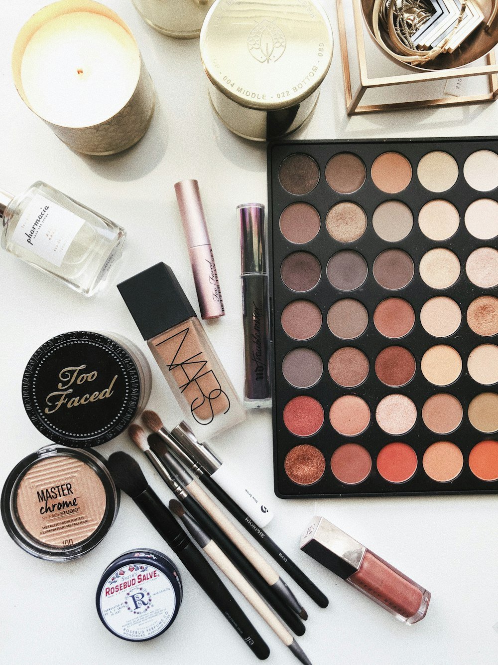 Makeup palette, brushes and cosmetics