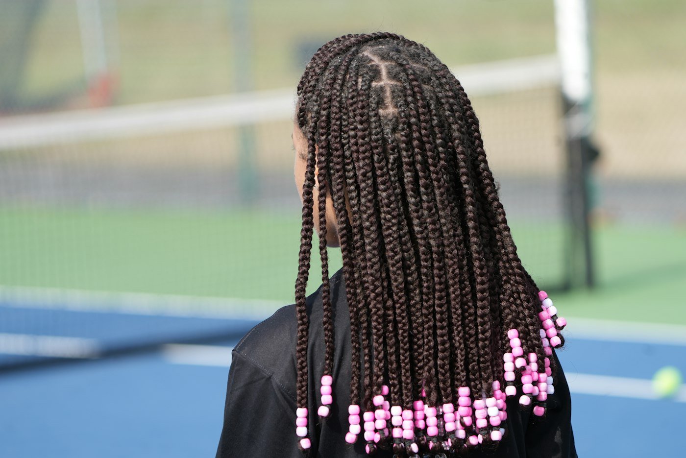 Long braids finished with beads