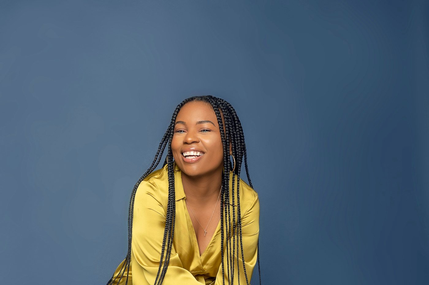 Laughing woman with long braided hair