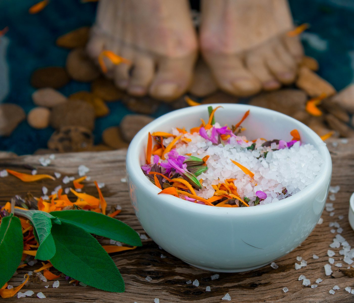 Bowl of bath salts with flower petals