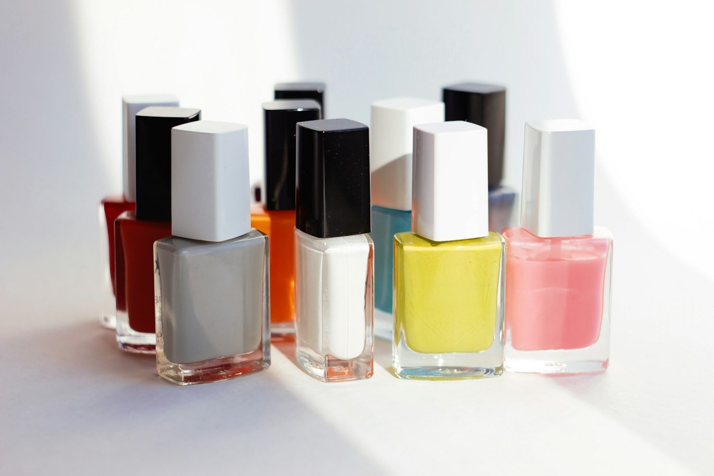 A row of nail polish bottles in many colours