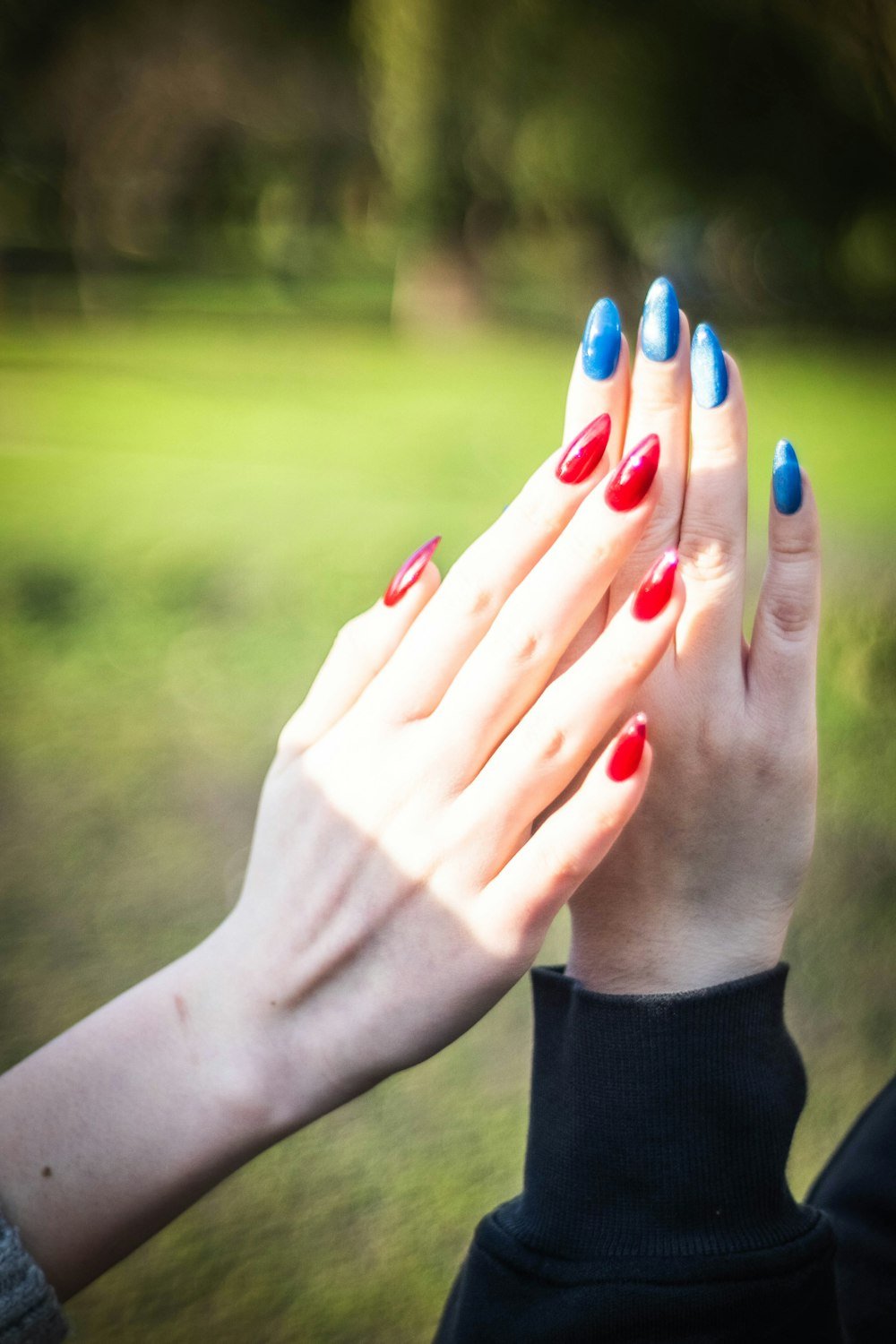 Two hands with matching manicures