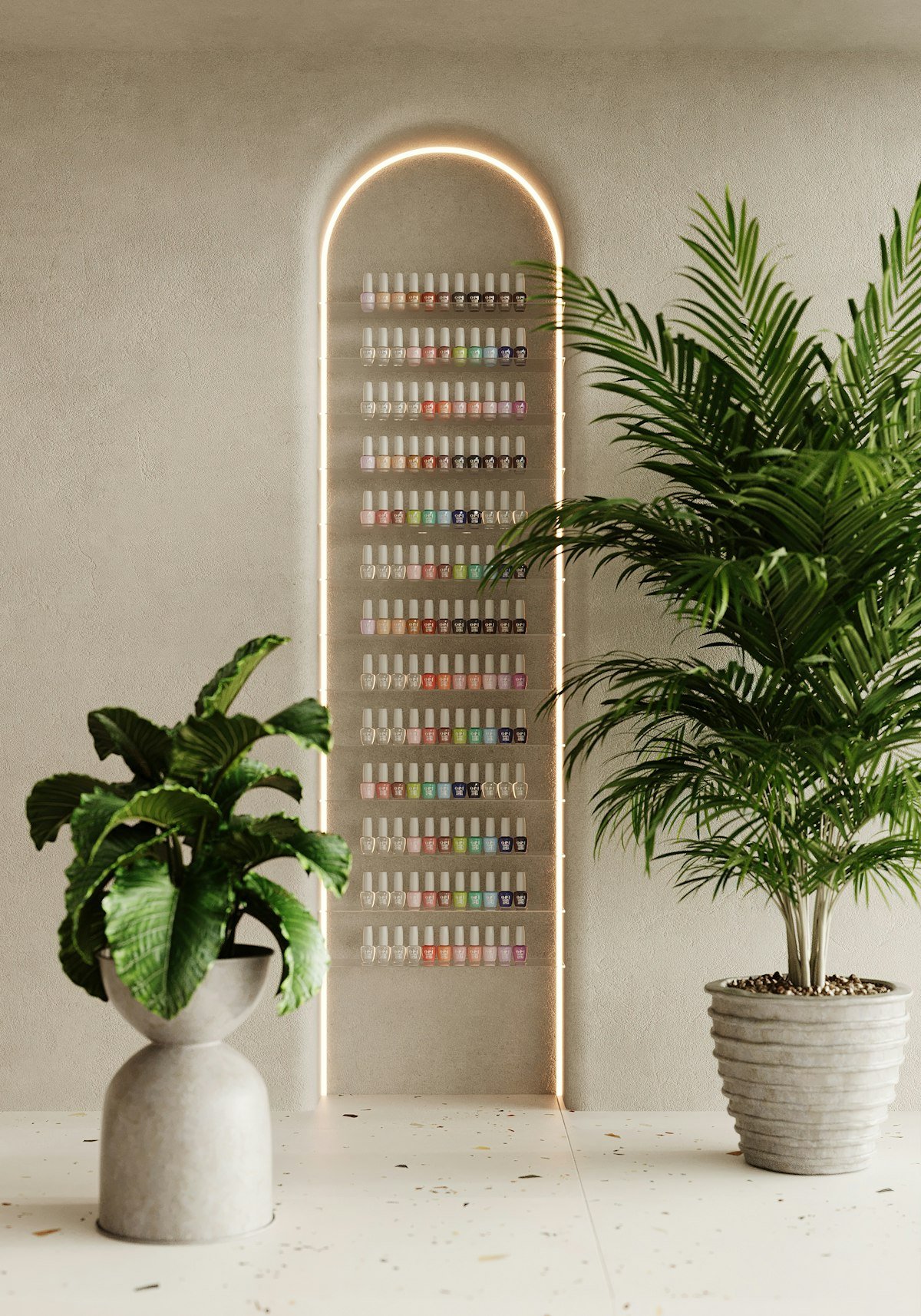 Arched wall display of nail polish between potted plants